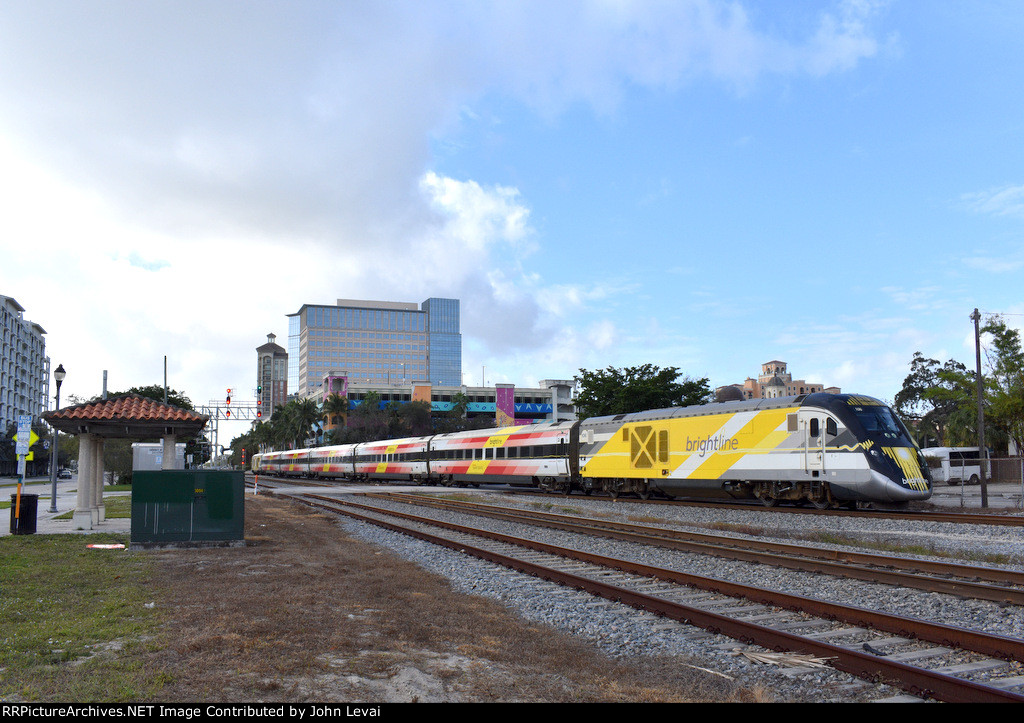  Northbound Brightline Bright Red consist arriving into WPB Station  